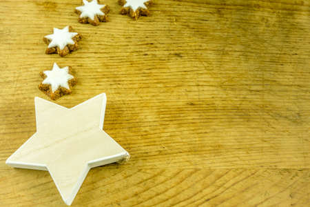 Christmas decoration with stars of various sizes on a rustic boardの写真素材