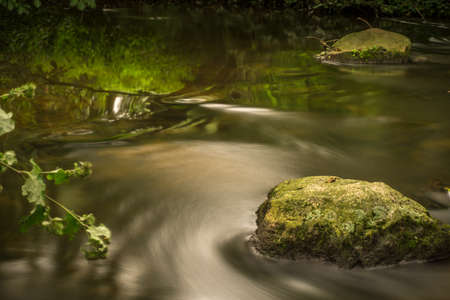 Stone and water in a small brook, time exposureの写真素材