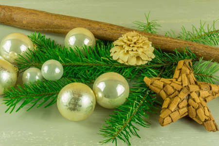 Christmas decoration with cinnamon stars, Christmas balls and pine branchの写真素材