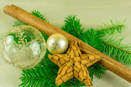 Christmas decoration with cinnamon stars, Christmas balls and pine branchの写真素材