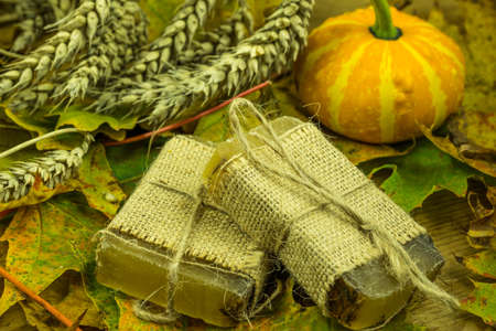 Handmade soap with colored autumn decorationの写真素材