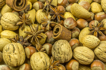 Christmas decoration from different varieties of nuts, cinnamon and anise stars