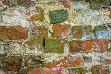An old brick wall as a backgroundの写真素材