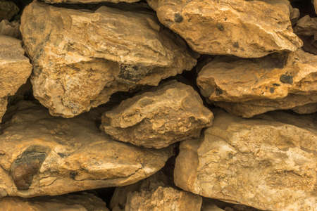 A wall of yellow lava rock as a background