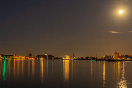 A harbor at night with light from the moon and long exposureの写真素材