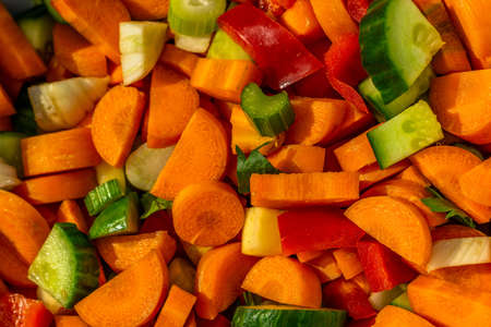 different varieties of vegetables cut into small piecesの写真素材