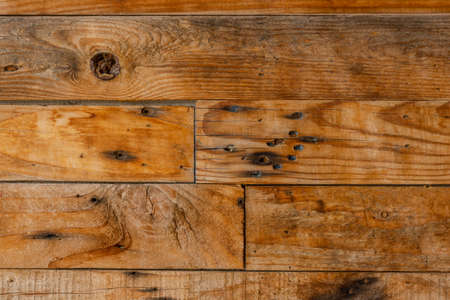 An old wooden background with different colors from horizontal boardsの写真素材
