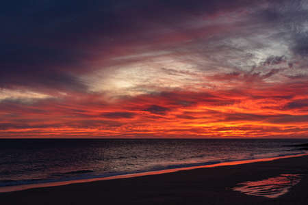 A blood red sunset on the coast of Canary Island Fuerteventuraの写真素材