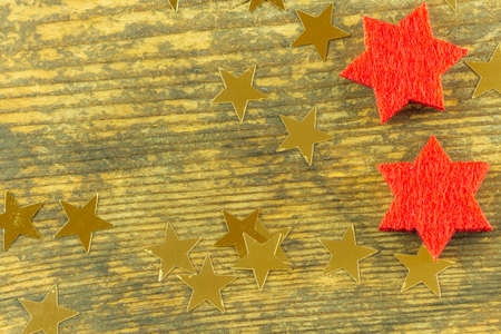 different stars in different colors lie on an old wooden boardの写真素材