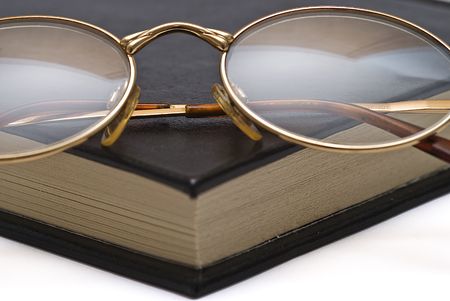 Glasses on the corner of the book.の写真素材
