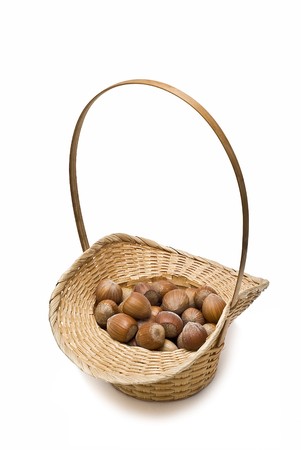 A basket with hazelnuts isolated on a white background.の写真素材