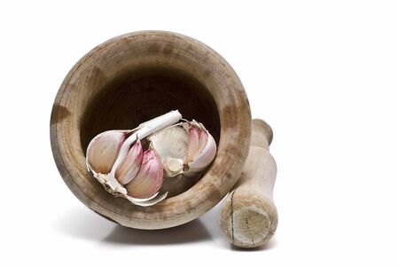 Garlic in a mortar and pestle.の写真素材