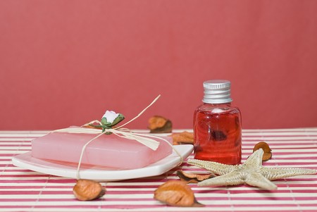 Spa background with hygiene items in red.
