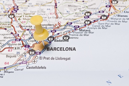 A pin on a roads map.