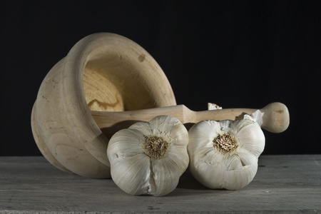Still life with garlic, mortard and pestle.の写真素材