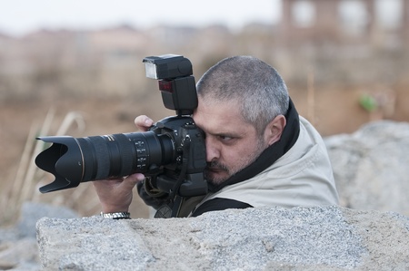 War photojournalist working in a dangerous environment.