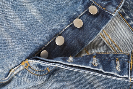 Detail of the fly of the jeans with button closureの写真素材