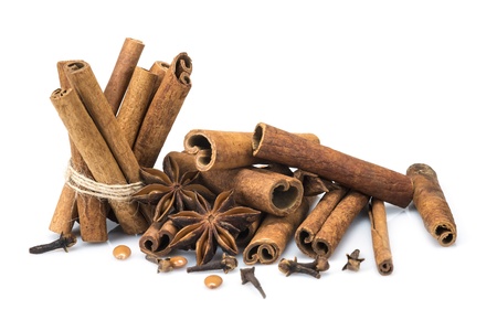 Cinnamon sticks and star anise isolated over a white background