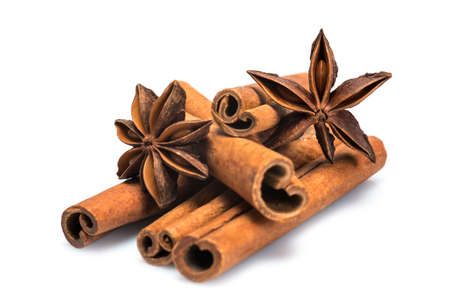 Cinnamon sticks and star anise isolated over a white background