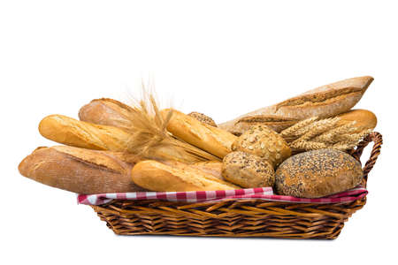 Still life about a basket with a large bread assortment isolated over a white backgroundの写真素材