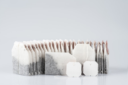 Tea bags isolated over a whiteの写真素材