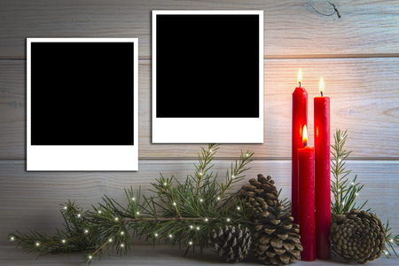 Christmas wooden background with candles and a space for text or photoの写真素材