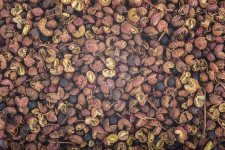 Background made of sichuan pepper showing its textureの写真素材