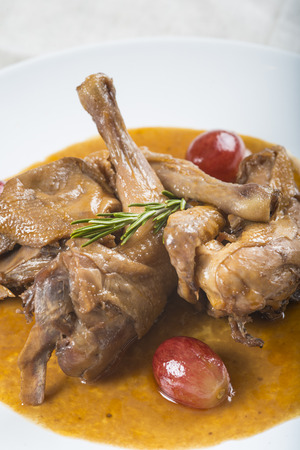 Poussin with grape sauce decorated with some whole grapesの写真素材