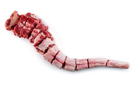 Raw oxtail cut isolated on a white backgroundの写真素材