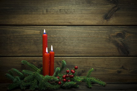 Christmas background made of wood with candlesの写真素材