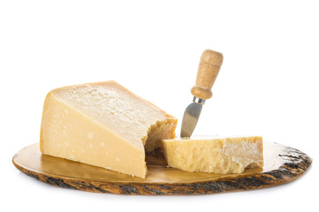 Aged parmesan cheese or parmigiano reggiano isolated on a white backgroundの写真素材