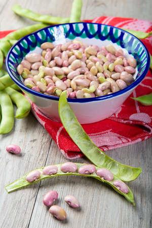 Getting beans from their pods and preparing them for cooking in the kitchen