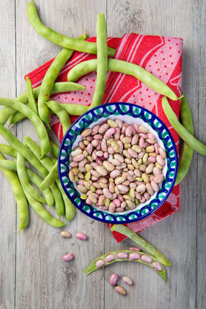 Getting beans from their pods and preparing them for cooking in the kitchenの写真素材