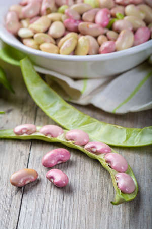Getting beans from their pods and preparing them for cooking in the kitchen