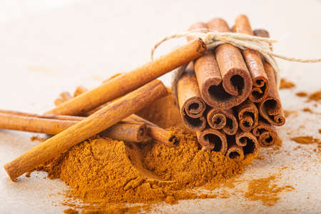 cinnamon sticks and ground powder with a copy space