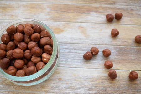 tree nuts in a glass jar isolated on white backgroundの写真素材