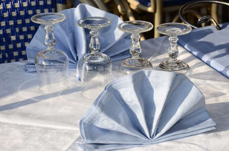 restaurant table decorated with towelsの写真素材