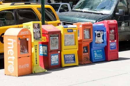 New-York City, USA - May 4, 2015: free newspaper dispensers in a street of Manhattanのeditorial素材