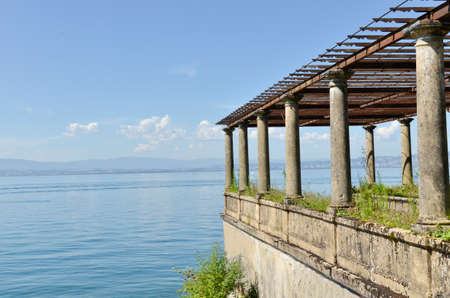 old landing stage with pillars on the lake