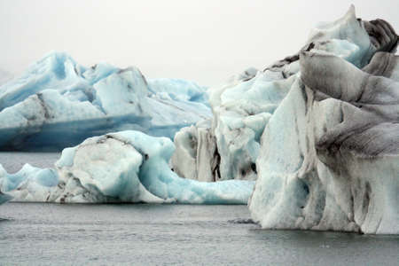 Blue ice floating in the Jokulsarlon lake in the south of Iceland.の写真素材
