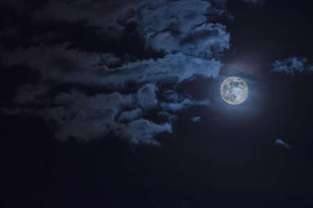 Moon and clouds night background, Halloween night.の写真素材