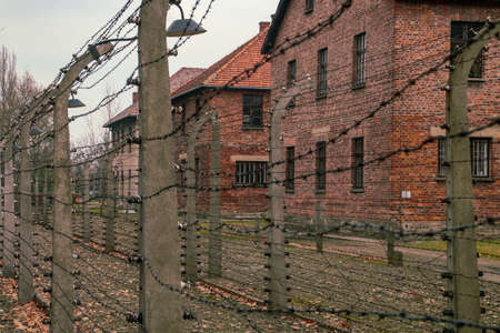 Auschwitz I concentration camp in Oswiecim, Poland. Barracks and electrified fence of the concentration camp.のeditorial素材