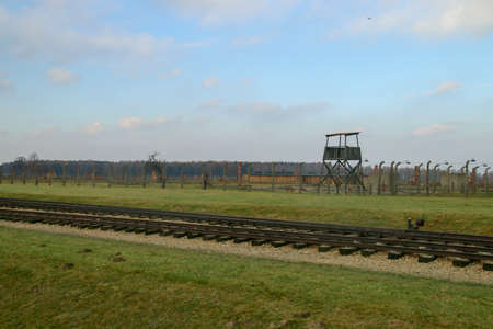 Auschwitz-Birkenau concentration camp in Oswiecim, Poland. Electrified fence and security checkpoints that run the entire perimeter of the concentration camp.のeditorial素材