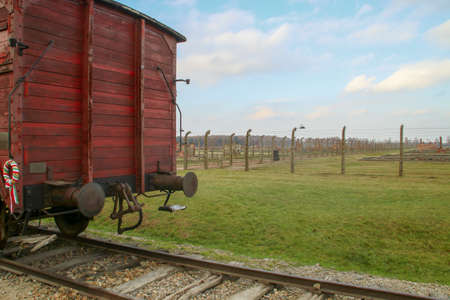 Auschwitz-Birkenau concentration camp. Red train carriage in the concentration camp of Auschwitz-Birkenau in Oswiecim.のeditorial素材