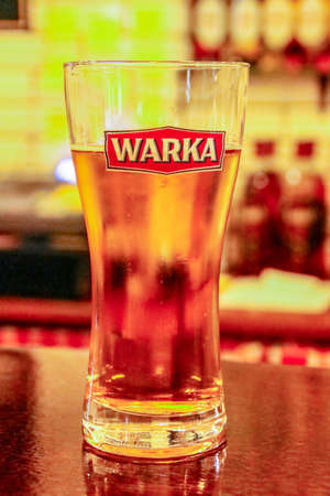 Krakow / Poland; 11/12/2016. A pint of Warka beer. Brand of beers of Polish origin.