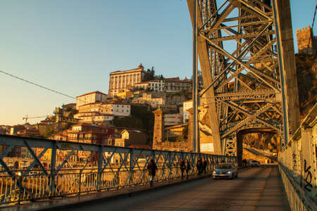 Porto / Portugal; 01/19/2017. Dom Luis I bridge and Ribeira neighborhood in Porto at sunset.のeditorial素材