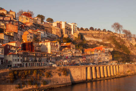 Porto / Portugal; 01/19/2017. Gustave Eiffel avenue (Ribeira neighborhood) and the river Douro in Porto at sunset.のeditorial素材