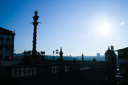 Backlit pillory on a sunny day on the esplanade of the Porto Cathedral (Portugal).