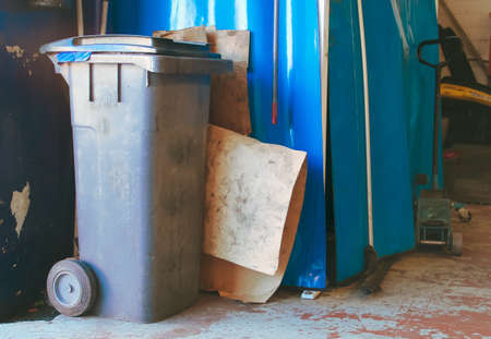 Solid waste container in a mechanical workshop in Madrid, Spain.の写真素材
