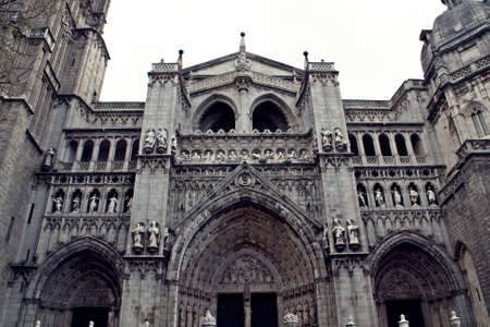 Cathedral of Toledo, Spain. Architecture and art gothic in Spain. Main facade with the door of the...